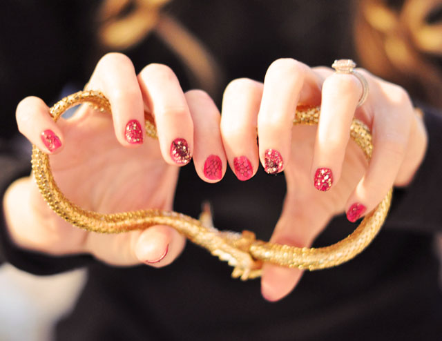 Glittery Pink and Red Nails with Gold Accessories